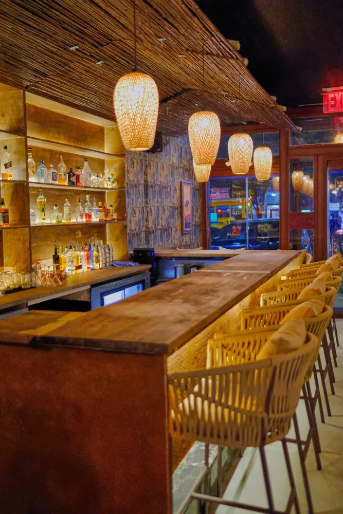 Rattan pendant lights over the bar at Elephant Ear Thai, Hell's Kitchen Rattan pendant lights over the bar at Elephant Ear Thai, Hell's Kitchen