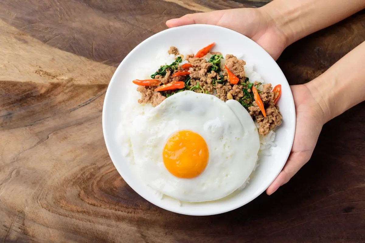 Pad kra pao holy basil stir-fry with crispy fried egg and rice