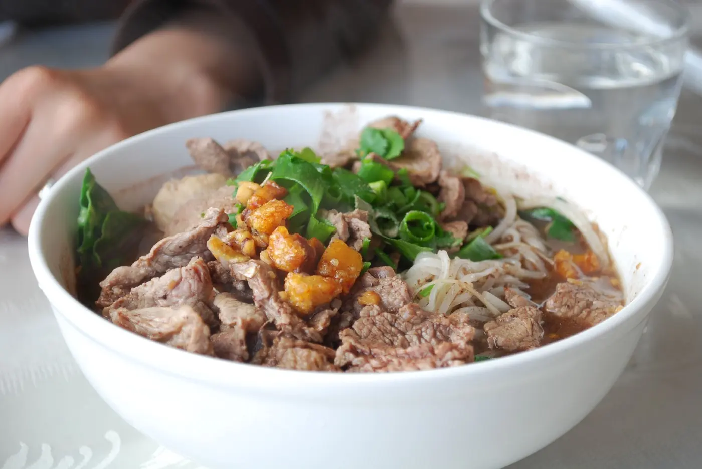 Thai boat noodles kuay teow ruea in rich dark broth