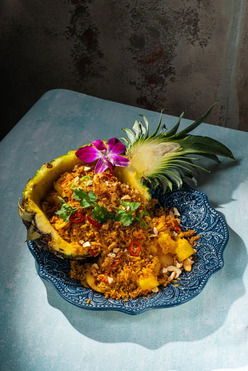 Pineapple fried rice in a carved pineapple at Elephant Ear Thai Eatery, Hell's Kitchen NYC Pineapple fried rice in a carved pineapple at Elephant Ear Thai Eatery, Hell's Kitchen NYC