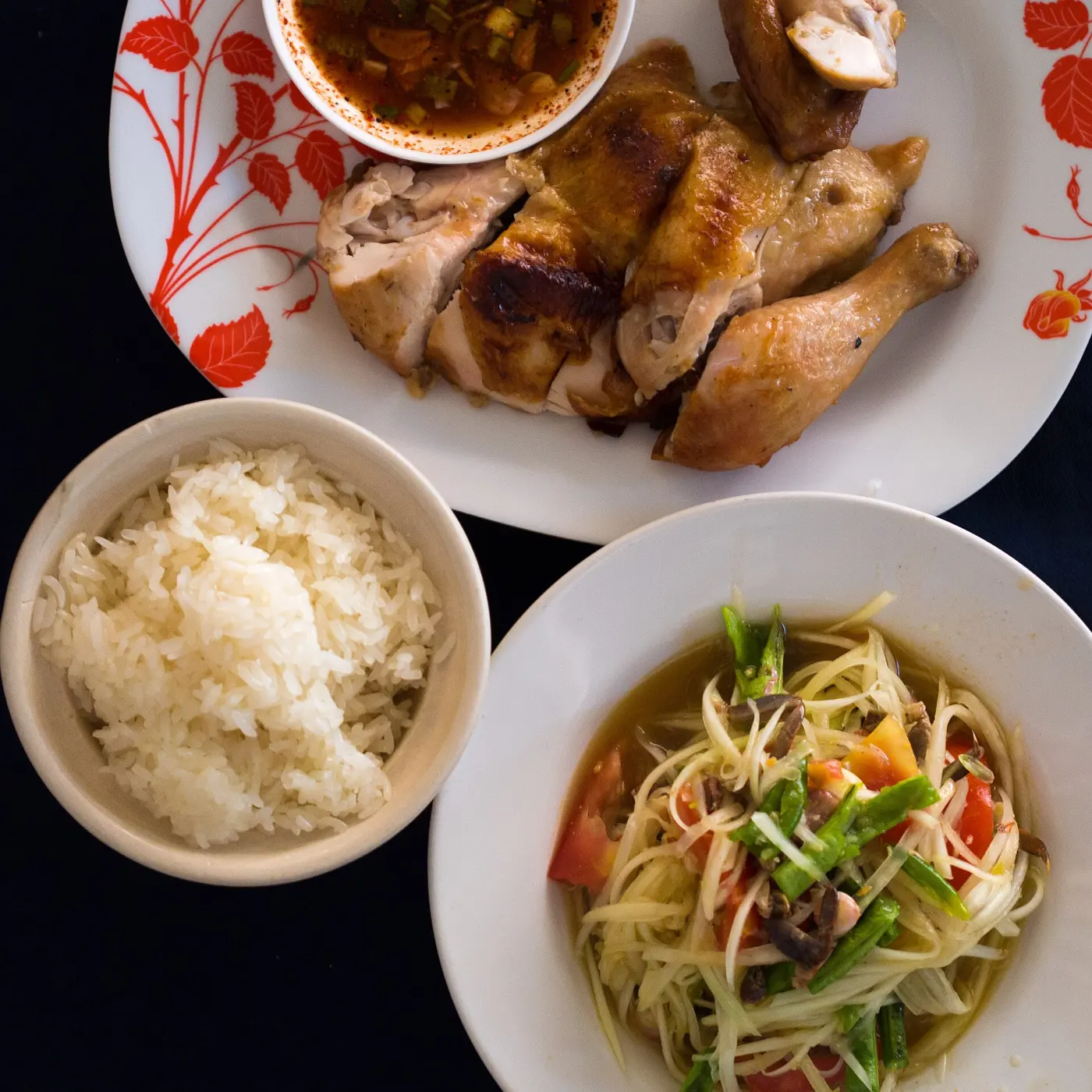 Som tam with sticky rice and gai yang grilled chicken
