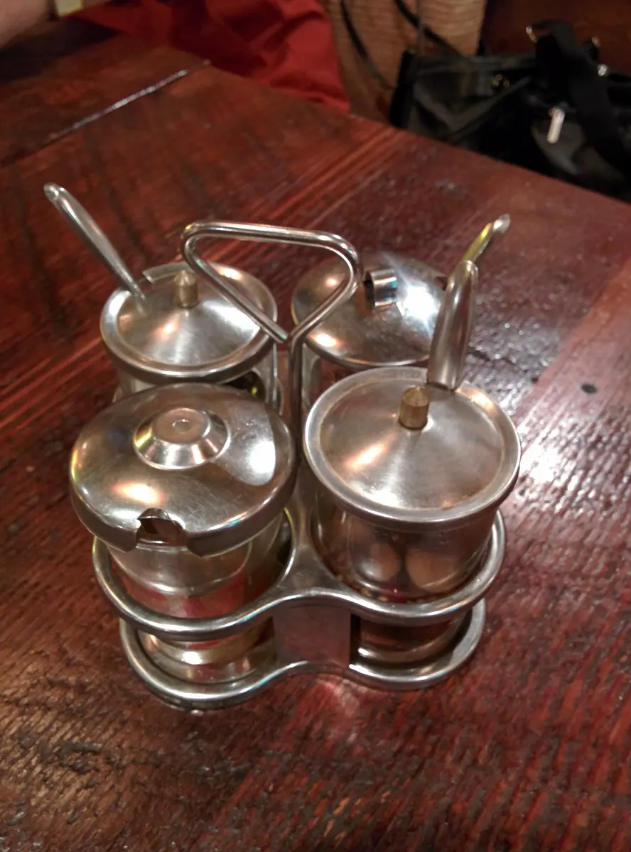 Thai Condiment Set Thai table condiment set with fish sauce, sugar, chili vinegar and chili flakes